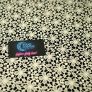Ivory Flower Lace Pattern on Black Printed Spandex Fabric | Blue Moon Fabrics