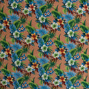 Warm salmon-pink Hawaiian floral print with orange and white hibiscus flowers for custom apparel and home decor.